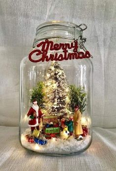 a glass jar filled with christmas decorations