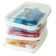 three plastic containers filled with assorted items on top of each other in front of a white background