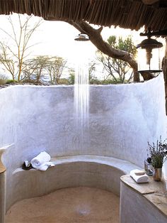 an outdoor shower in the corner of a room