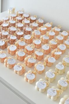 a white table topped with lots of small cookies