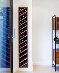 a wine rack in the corner of a room