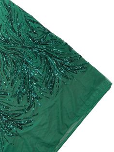 a green cloth with sequins on it