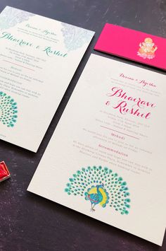 the wedding stationery is set up on the table