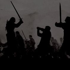 the silhouettes of two men holding swords are shown in this black and white photo