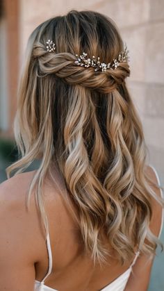 a woman with blonde hair wearing a bridal headpiece