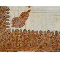 An unbelievable early 20th century Kirman silk embroidered Suzani textile with a beautiful pattern of densely embroidered paisley pattern woven in myriad colors of silk thread surrounding a relatively empty field containing four large paisley shapes. Bohemian Jamawar Pashmina Shawl With Intricate Embroidery, Traditional Embroidered Pashmina Fabric With Traditional Patterns, Traditional Embroidered Pashmina Fabric With Patterns, Traditional Jamawar Pashmina Shawl With Intricate Embroidery, Bohemian Embroidered Tussar Silk Fabric With Traditional Patterns, Bohemian Tussar Silk Fabric With Traditional Embroidery, Traditional Multicolor Paisley Print Dupatta, Bohemian Embroidered Pashmina Fabric With Zari Work, Traditional Multicolor Embroidered Pashmina Shawl