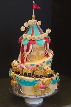 there is a very large cake that looks like a circus tent on top of it