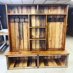 an old wooden cabinet with open doors and shelves