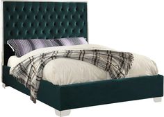 a bed with a green upholstered headboard and plaid pillows on it's sides