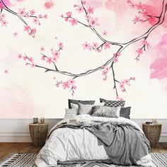 a bedroom with pink flowers painted on the wall