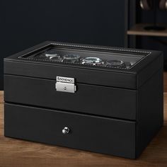 Experience the epitome of sophistication with our exquisite Watch Box, meticulously designed to organize timepieces with a display size of up to 48 mm across its dual layers, presenting ample storage space for your distinguished collection. The option to remove the watch pillows further enhances versatility, allowing you to safeguard your valuable jewels with ease. Modern Black Box Watch Accessories, Modern Black Box-shaped Watch Accessories, Modern Black Watch Accessories With Box, Luxury Black Watch Accessories For Gift, Luxury Black Watch Accessories As Gift, Elegant Black Watch Accessories With Box, Sleek Watch, Watch Display Case, Watch Organizer