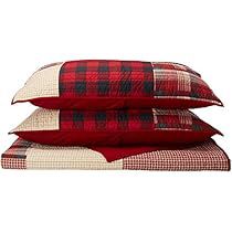 three red and white plaid pillows stacked on top of each other in front of a white background