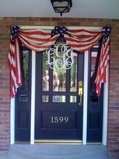 an american flag draped over the front door