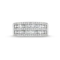 a white gold ring with three rows of diamonds on the sides and two rows of round brilliant