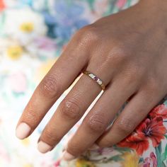 a woman's hand with a ring on it