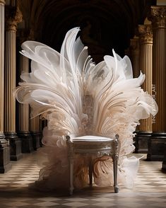 a chair made out of feathers sitting on top of a checkered floor