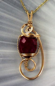 THE BEAUTY OF RED RUBY Amazing 18x13 MM RUBY gemstone----- set in handcrafted 14KT ROLLED GOLD ---- a custom design. gemstone with high detail which cannot be seen in the photograph. The pendant -- Intricate detail that you can see and notice MEASURES 2 inches long Very delicate and intricate in appearance and will get you noticed! One of a kind handcrafted piece of jewelry that anyone will look good in The pendant is absolutely amazing something that you will be proud to wear AAA Quality Gemsto Gold Ruby Fine Jewelry Gemstones, Gold Ruby Gemstones For Anniversary, Unique 14k Gold Wire Wrapped Jewelry, Hand Forged Red Jewelry For Anniversary, Hand Forged Gold Ruby Jewelry, Gold Wire Wrapped Jewelry For Anniversary, Unique Gold Jewelry With Ruby, Unique Gold Ruby Jewelry, Gold Ruby Birthstone Jewelry