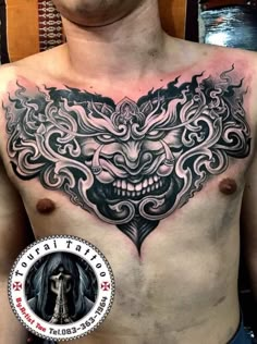 a man with a tattoo on his chest