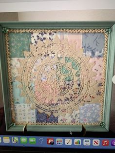 an image of a computer screen that is decorated with doily and paper work on it