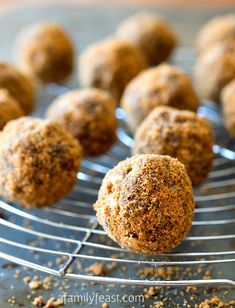 several balls of food sitting on a metal rack