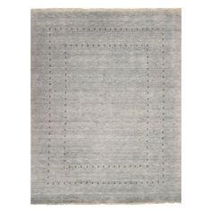 an area rug with squares and dots on the bottom in light grey, white and beige colors