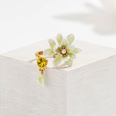 Gardenia Ring is a flower ring from Selenichast jewelry store. This is from nature jewelry and according its material, it??s also enamel jewelry which can be adjusted. Dress up your hand with this delicate ring. This adjustable flower ring features a white gardenia facing a yellow faceted glass stone. Simple yet delicate. This stylish designer jewel is almost perfect for all occasions and help add a touch of femininity and brightness to your outfits. White Gardenia, Almost Perfect, Delicate Rings, Enamel Jewelry, Faceted Glass, Nature Jewelry, Open Ring, Flower Ring, Jewelry Store