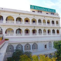 a large white building with many windows and balconies