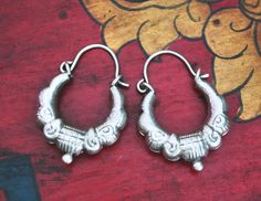 Here we have a pair of nepalese or indian XS - sized 800 silver hoop earrings made  with repoussee technique! I just love them! Easy to wear, as they are hollow.  And they fit very well for every day and for every outfit!  Measurements are: Total length: 28mm (1.1") Outer Diameter: 19mm (0.75") Weight of pair: 4gr. These hoops ship registered priority and with tracking! :-) ❀ Please read my shop and return policies before purchasing ❀ https://www.etsy.com/shop/CosmicNorbu/policy?ref=shopinfo_policies_leftnav Indian Hoop Earrings, Nepali Jewelry, Silver Jewelry Diy, Silver Jewellery Indian, Earrings Indian, Necklace For Girlfriend, Silver Jewels, Ruby Jewelry, Engraved Necklace