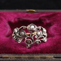 This wonderful early Georgian ring is known as a giardinetto/giardinetti (Italian for "little garden(s)"). These floral-themed rings reflect the mid 18th century taste for delicate, elegantly composed Rococo styles, a departure from the from the heavier and more ostentatious styles of earlier years. Giardinetti rings - sometimes fluid and asymmetrical, sometimes even and balanced - typically feature diamonds and small colored gemstones. These rare jewels were designed to compliment the floral fa 18th Century Wedding Ring, Regency Ring, 18th Century Jewelry, Pearl Cluster Ring, Georgian Ring, Diamond Star Necklace, Antique Jewelry Rings, Georgian Jewelry, French Jewelry