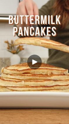 a stack of pancakes sitting on top of a white plate