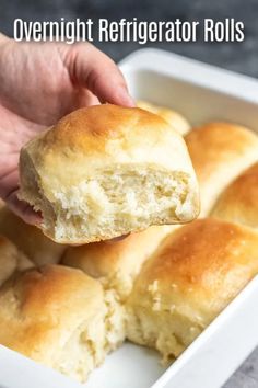 a person holding a piece of bread over a white dish with the words overnight refrigerator rolls on it