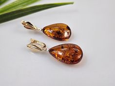 Brown Amber earrings. Not pressed but natural gemstone. Each earrings are teardrop shape. Each earrings can be slightly different due amber is being natural and each is handmade. Total length about 4,5 cm. Set contains: one pair of earrings and extra tops which you can change when needed (gold color and ailver ear wire and lever back and atud in). Due to amber being natural, each of my jewelry is unique and even the same models can be slightly different. Please contact me for more details, photo Formal Brown Teardrop Earrings, Brown Teardrop Earrings For Formal Occasions, Hypoallergenic Amber Teardrop Jewelry, Elegant Brown Teardrop Earrings For Gift, Amber Teardrop Earrings As A Gift, Amber Teardrop Earrings Gift, Amber Teardrop Drop Earrings For Gift, Hypoallergenic Amber Teardrop Earrings, Elegant Brown Drop Earrings