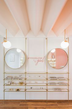 the inside of a store with mirrors and jewelry