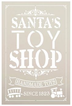 a white sign that says santa's toy shop