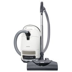 a white vacuum cleaner sitting on top of a floor