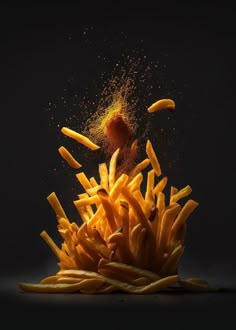 a pile of french fries falling into the air