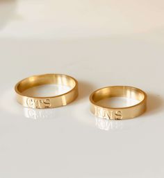 Customize our 4 mm band with your initials or short word. Designed with a 4 mm wide band stamped with capitalized letters. Enter up to 5 letters in the txt box above 14k gold filled Band width: 4 mm Band thickness: 0.8 mm *This ring is soldered from gold-filled wire and may have a visible solder joint. Joints are normal in gold filled rings and are highly polished for minimal visibility. Made to order. Please allow 7 business days for processing. Simple Gold Initial Ring For Anniversary, Promise Ring With Initials In 14k Gold, Simple Gold Engraved Ring For Anniversary, Classic Custom Name Jewelry For Promise, Gold Initial Ring With Custom Name For Promise, 14k Gold Initial Ring For Promise With Custom Name, Promise Ring With Custom Name In 14k Gold, Minimalist 14k Initial Ring For Promise, Classic Wedding Initial Ring With Custom Name