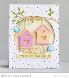 a birthday card with two bird houses on it