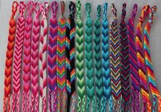 many different colored braids are lined up together