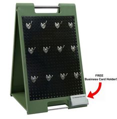 a black and green peg board with several silver objects on it's sides, labeled free business card holder