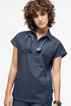 It’s a bit of a departure, but we love this scrub top. The polo collar and 3-snap placket give it a polished look, while the relaxed fit and dolman sleeves make it so comfortable. Each piece in our Movement by Butter-Soft Collection is built with our innovative 4-way stretch fabric that also repels lint, fur, and hair for a modern, flattering fit. • Relaxed fit • Polo collar • Front snap placket • Pouch pocket with self pocket bag inside • 1 mesh cell pocket • 1 invisible zip pocket on left shou Plus Size Scrubs, Scrub Shoes, Scrubs Dress, Scrubs Outfit, Uniform Advantage, Easy Stretches, Medical Uniforms, Nurse Uniform, Bag Inside