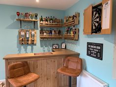 a bar with two brown chairs next to it