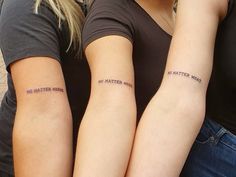 two women with matching tattoos on their arms, one has the words no matter what