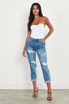 Elevate your denim game with these High Waisted Boyfriend Jeans. Featuring front distress and a pin-tucked waistline, these jeans offer a trendy and relaxed look. The whiskered wash adds to their stylish appeal, and the zip fly ensures easy wear. With a high-waisted fit, these jeans are not only fashionable but also flattering. Whether you dress them up or down, they'll become a versatile staple in your wardrobe. (3) Rise: 10.25", Inseam: 28"(unfold) Model is 5'8" and wearing a size 3  Style: Ed High Waisted Boyfriend Jeans, Rare Fashion, Easy Wear, High Jeans, Distressed Jeans, Cropped Jeans, Boyfriend Jeans, High Waist Jeans, Jeans Fit