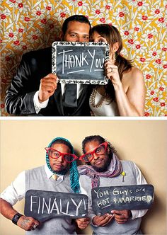 two people holding up signs that say thank you