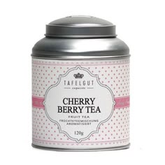 a tin with a label on it that says strawberry short cake tea in front of a white background