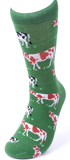 a pair of green socks with cows and horses on them, all in different colors