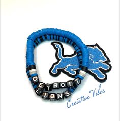 *This listing is for a set of 2  bracelets.* Stretchy friendship bracelets to wear so you can root for your favorite Detroit Lions Handmade from various beads. Due to the custom nature of these bracelets, no two will be exactly the same. No returns accepted. Please contact me if you have any issues. Detroit Lions Bracelet, Adjustable Heishi Beads Friendship Bracelet, Hand Wrapped Heishi Beads For Gift, Customized Adjustable Blue Bracelets, Personalized Blue Heishi Beads Bracelets, Ford Field, Sport Theme, Lion Bracelet, Bracelet Ideas