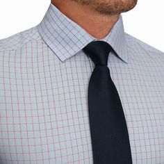 Our signature athletic fit dress shirt crafted from performance stretch fabrics. "The Weston" Light Blue, Pink & Black Plaid is an excellent business casual staple that makes a versatile addition to any dress shirt collection. Fit: More room in the upper body with a tapered waist Fabric Feel: Four-way stretch performance polyester / spandex fabric Fabric Function: Moisture-wicking, lightweight and wrinkle free Styling: Structured semi-spread collar and single button angled cuffs Additional Styli Fitted Smart Blue Dress Shirt, Tailored Blue Dress Shirt For Business, Smart Blue Dress Shirt For Office, Smart Blue Office Dress Shirt, Smart Blue Dress Shirt For Work, Smart Blue Dress Shirt For Business Casual, Blue Short Sleeve Dress Shirt For Business, Pink Black Plaid, Polyester Spandex Fabric