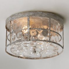 a light fixture hanging from the ceiling in a room